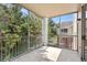 Screened in balcony view of green trees and complex buildings at 13037 Mulberry Park Dr # 529, Orlando, FL 32821