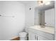 Bathroom features a single sink vanity, mirror and white walls at 13037 Mulberry Park Dr # 529, Orlando, FL 32821