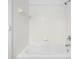Bathroom with white tiles and tub with shower at 13037 Mulberry Park Dr # 529, Orlando, FL 32821