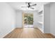 Bedroom has a balcony, built-in shelving and light wood-look floors at 13037 Mulberry Park Dr # 529, Orlando, FL 32821