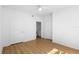 Bedroom has wood-look flooring and multiple doors at 13037 Mulberry Park Dr # 529, Orlando, FL 32821