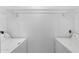 Bright laundry room featuring a washer, dryer, and shelving at 13037 Mulberry Park Dr # 529, Orlando, FL 32821