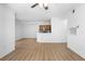 Spacious living room and kitchen area with wood-look flooring and a ceiling fan at 13037 Mulberry Park Dr # 529, Orlando, FL 32821