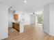 Open living area with hardwood floors and stainless steel appliances at 13037 Mulberry Park Dr # 529, Orlando, FL 32821