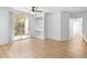 Bright living room with sliding glass doors to balcony and built-in shelving at 13037 Mulberry Park Dr # 529, Orlando, FL 32821