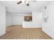 Spacious living room featuring light wood flooring and neutral wall color at 13037 Mulberry Park Dr # 529, Orlando, FL 32821