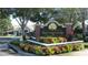 Well-maintained Plantation Park entrance sign with brick and colorful landscaping, advertising luxury condominiums at 13037 Mulberry Park Drive Dr # 529, Orlando, FL 32821