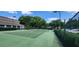 A beautifully maintained tennis court on a sunny day, ready for a game with friends and Gathering at 13037 Mulberry Park Drive Dr # 529, Orlando, FL 32821