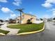 Residential home with a palm tree and a well-manicured lawn on a sunny day at 14200 Crystal Key Pl, Orlando, FL 32824