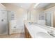 Bathroom features double sinks, separate shower, and soaking tub at 2422 Black Powder Ln, Kissimmee, FL 34743