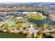 Aerial shot of neighborhood community park near ponds and tennis courts at 2422 Black Powder Ln, Kissimmee, FL 34743