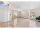 Bright foyer with tiled floors, a high ceiling, and elegant chandelier at 2422 Black Powder Ln, Kissimmee, FL 34743