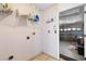 Laundry room area with shelving and access to garage at 2422 Black Powder Ln, Kissimmee, FL 34743