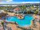 Aerial view of large community pool and clubhouse at 2573 Reading Trl, Kissimmee, FL 34746