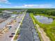 Panoramic aerial view of a modern residential community with homes, lakes, and lush landscapes at 2573 Reading Trl, Kissimmee, FL 34746