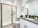 Modern bathroom featuring a glass-enclosed shower and sleek vanity at 2573 Reading Trl, Kissimmee, FL 34746