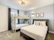 This bedroom features a bunk bed with a full sized bed underneath, grey walls, and modern wall art at 2573 Reading Trl, Kissimmee, FL 34746