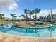 Community lazy river with island feature at 2573 Reading Trl, Kissimmee, FL 34746