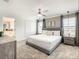 Comfortable main bedroom with a plush king bed, ample natural light, and closet at 2573 Reading Trl, Kissimmee, FL 34746