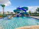 Community pool area with a fun water slide at 2573 Reading Trl, Kissimmee, FL 34746