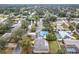 The aerial view highlights the community's tree-lined streets and well-maintained homes at 2805 Grassmere Ln, Orlando, FL 32808