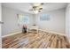 An empty bedroom features wood floors, neutral walls, and dual windows at 2805 Grassmere Ln, Orlando, FL 32808