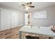 An empty bedroom features wood floors, neutral walls, a ceiling fan, and a large closet at 2805 Grassmere Ln, Orlando, FL 32808