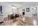 Elegant dining room with modern lighting, hardwood floors, and a neutral color palette at 2805 Grassmere Ln, Orlando, FL 32808