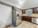 Well-lit kitchen featuring stainless steel appliances and ample counter space at 2805 Grassmere Ln, Orlando, FL 32808