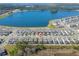 Aerial view of a community near a lake, highlighting the home's location within a well-planned neighborhood at 2977 Howley Aly, St Cloud, FL 34771