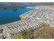 Wide aerial view of a community near a lake, showing the home's proximity to amenities and natural surroundings at 2977 Howley Aly, St Cloud, FL 34771