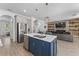 Kitchen island with stainless steel appliances, view to the living room and fireplace at 2977 Howley Aly, St Cloud, FL 34771