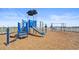 Community playground with slides, swings, and wood chip ground cover at 2977 Howley Aly, St Cloud, FL 34771