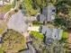 An aerial shot shows the house in the cul-de-sac and the neighborhood, highlighting the mature trees at 302 Log Run Ct, Ocoee, FL 34761