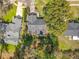 Aerial view of a house in a neighborhood featuring a backyard with green lawn and trees at 302 Log Run Ct, Ocoee, FL 34761