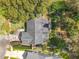 Aerial view of the property, showing its mature trees and landscaping at 302 Log Run Ct, Ocoee, FL 34761