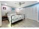 Bedroom features a queen bed, hardwood floors, ceiling fan, two closets and textured wall at 302 Log Run Ct, Ocoee, FL 34761