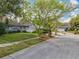 Charming single-story home with a manicured lawn and mature trees at 302 Log Run Ct, Ocoee, FL 34761