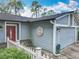 Inviting home exterior featuring gray siding, white trim, and a well-maintained front yard at 302 Log Run Ct, Ocoee, FL 34761