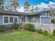 Close-up of a two-car garage featuring a clean facade and ample parking at 302 Log Run Ct, Ocoee, FL 34761