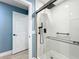 Bathroom with a tiled walk-in shower featuring a shower head and built-in shelves and seating at 302 Log Run Ct, Ocoee, FL 34761