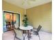 Charming outdoor patio offers comfortable seating and a view of the interior at 3050 Pirates Retreat Ct # 207, Kissimmee, FL 34747