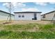 View of backyard showing slider, window and budding lawn at 3189 Viceroy Ct, Poinciana, FL 34759