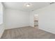 Well-lit bedroom featuring neutral carpet and access to an en-suite bathroom at 3189 Viceroy Ct, Poinciana, FL 34759