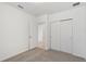 Bright bedroom with neutral carpet, closet, and white walls offers a serene, comfortable space at 3189 Viceroy Ct, Poinciana, FL 34759