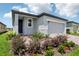 Attractive home exterior with brick driveway, colorful landscaping, and a 'Now Available' sign at 3189 Viceroy Ct, Poinciana, FL 34759