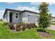 Inviting single-Gathering home with a well-manicured lawn, brick driveway, and vibrant landscaping at 3189 Viceroy Ct, Poinciana, FL 34759