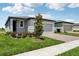 Charming single-Gathering home with a well-maintained lawn, brick driveway, and manicured landscaping at 3189 Viceroy Ct, Poinciana, FL 34759