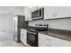 Close up of a kitchen with stainless steel appliances and granite countertops at 3189 Viceroy Ct, Poinciana, FL 34759