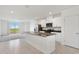 Bright kitchen with white cabinets, stainless steel appliances, and center island at 3189 Viceroy Ct, Poinciana, FL 34759